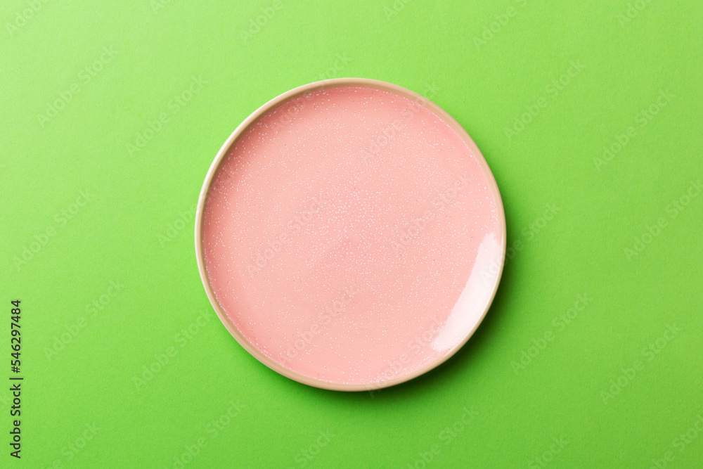 Top view of isolated of colored background empty round pink plate for food. Empty dish with space for your design Top view of isolated of colored background empty round pink plate for food. Empty dish with space for your design
