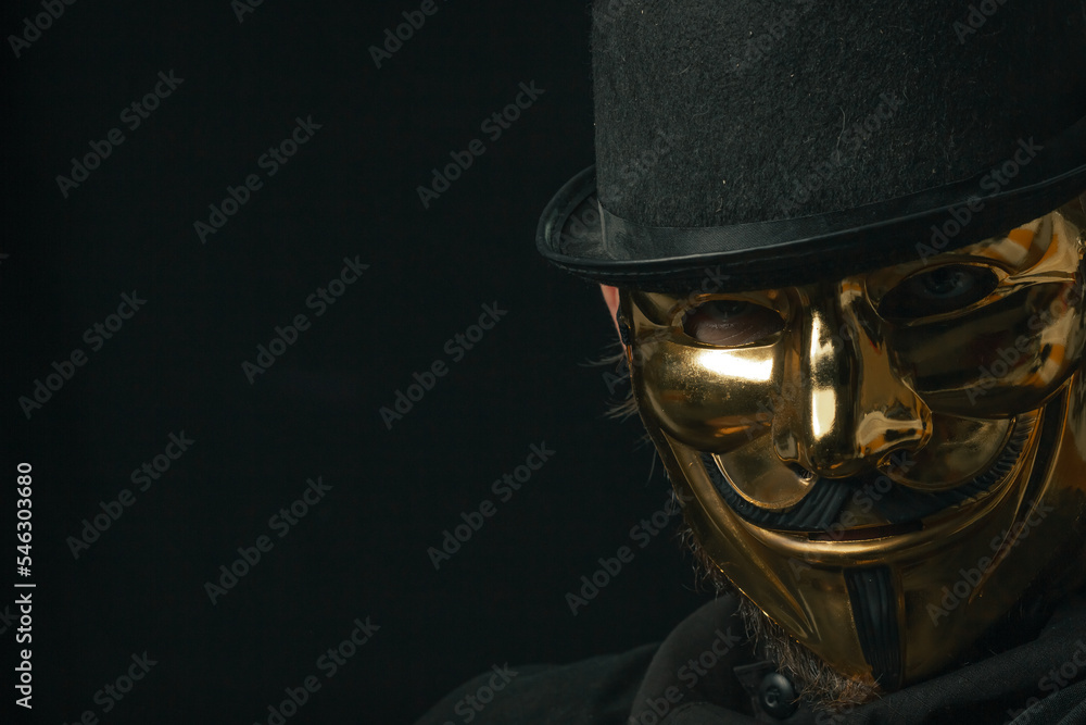 Fototapeta premium Scary figure with creepy mask and hat in the dark