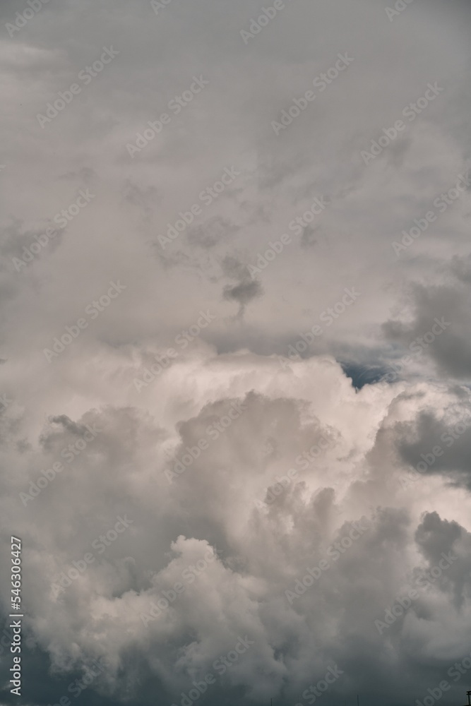Backdrop of a white cloud in a blue summer sky. Natural background with soft clouds.