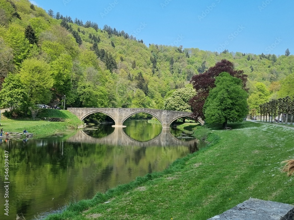 Old bridge over a small river in the Belgium Ardennes