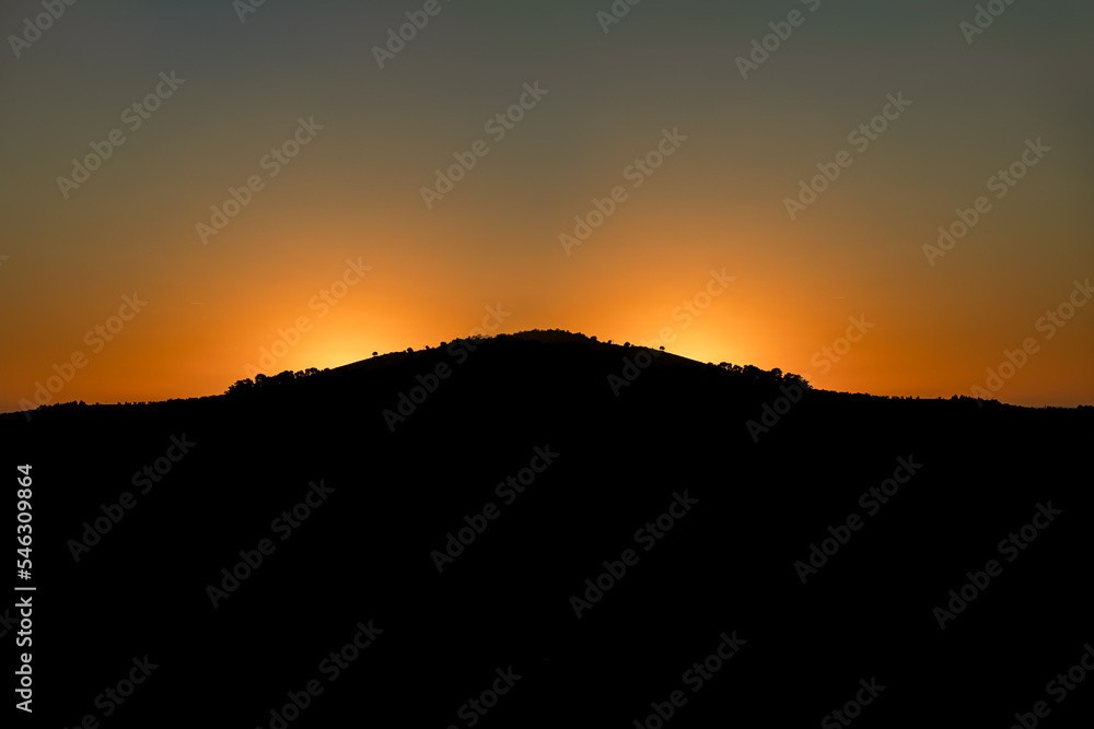 Orange sunset sky over mountain Orange sunset sky over mountain