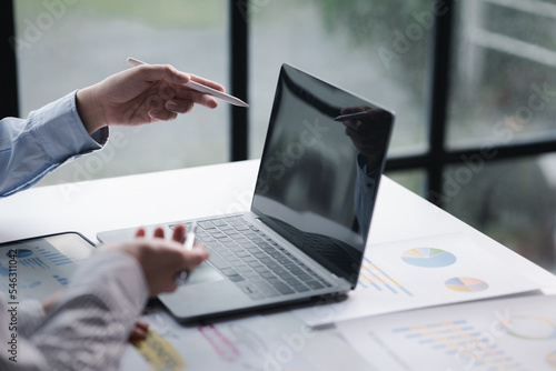 The sales department is having a monthly summary meeting to bring it to the department manager, they are verifying the correctness of the documents that are prepared before bringing in to the manager