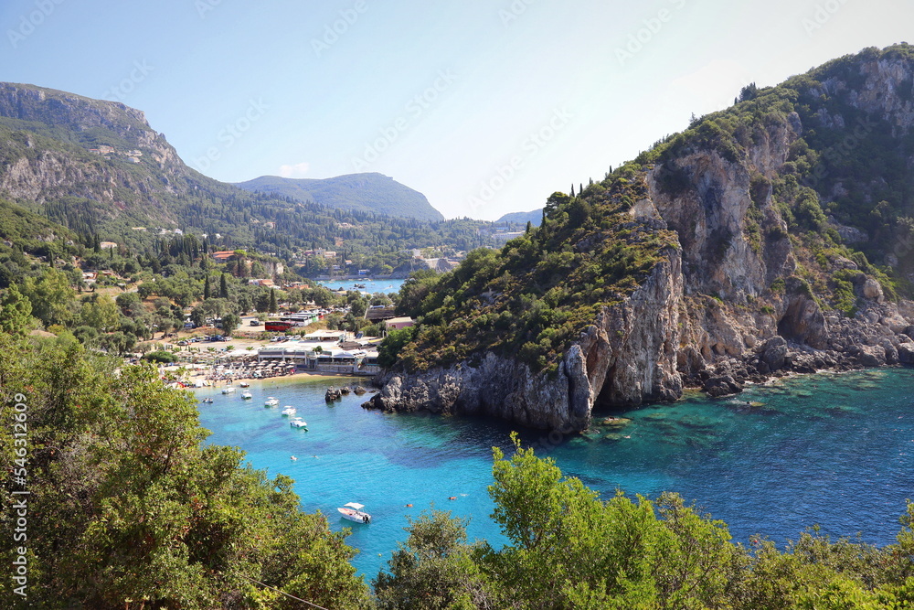 View of the amazing bay with beautiful crystal clear water and cliffs in Paleokastritsa, Corfu, Greece