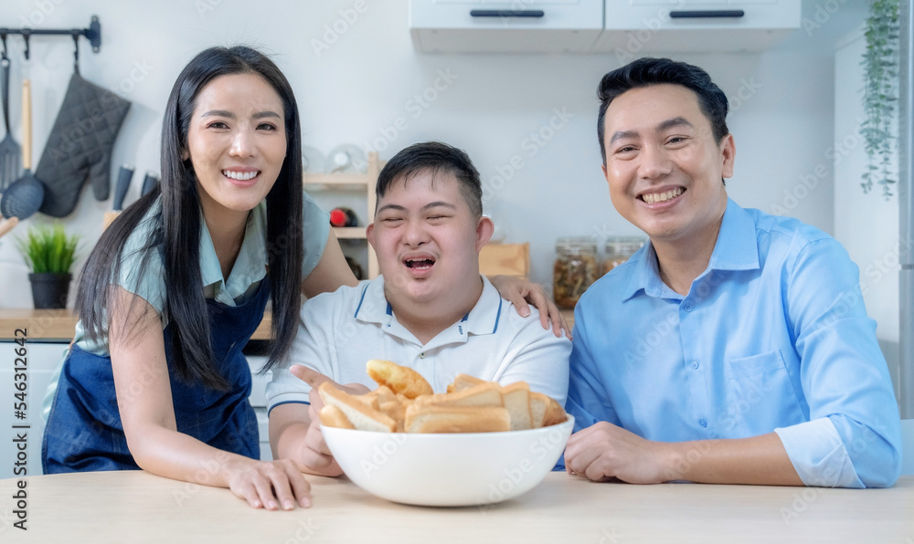 Happy Asian family eating together at home.
Happy Asian family eating together at home.