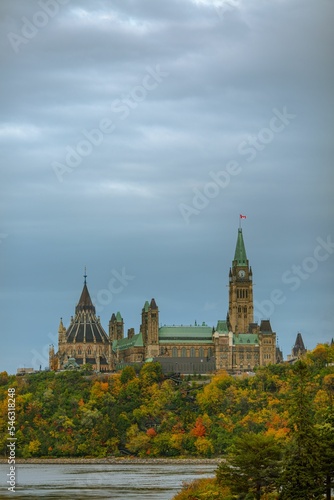 Vertical shot of historical Parliament Hill building in Ottawa, Canada on blue sky background