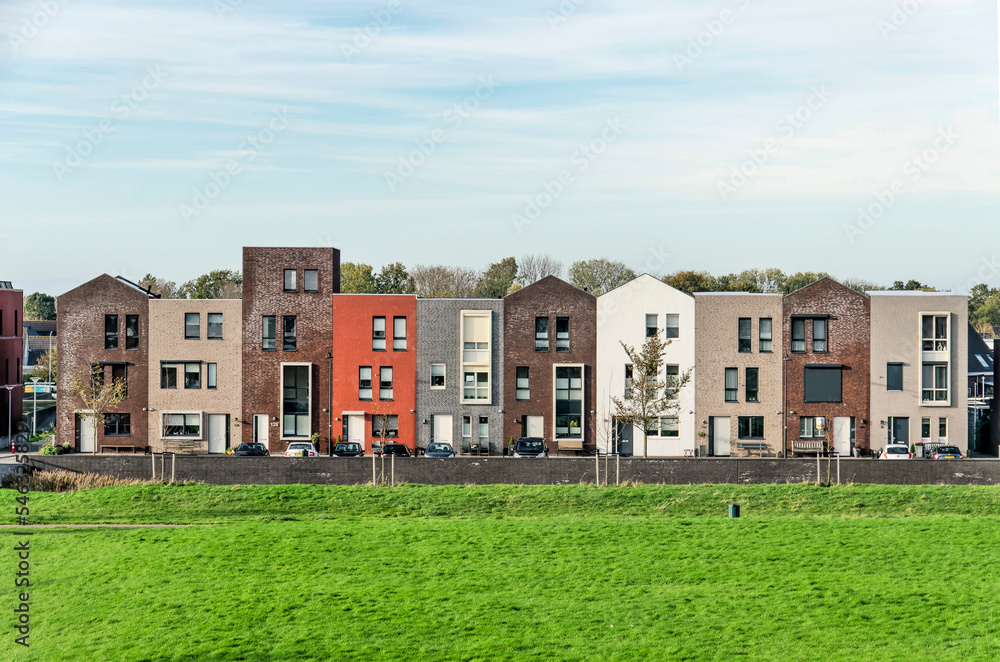 Zierikzee, The Netherlands, November 11, 2022: row of ten houses with varying colors and details to suggest individuality Zierikzee, The Netherlands, November 11, 2022: row of ten houses with varying colors and details to suggest individuality