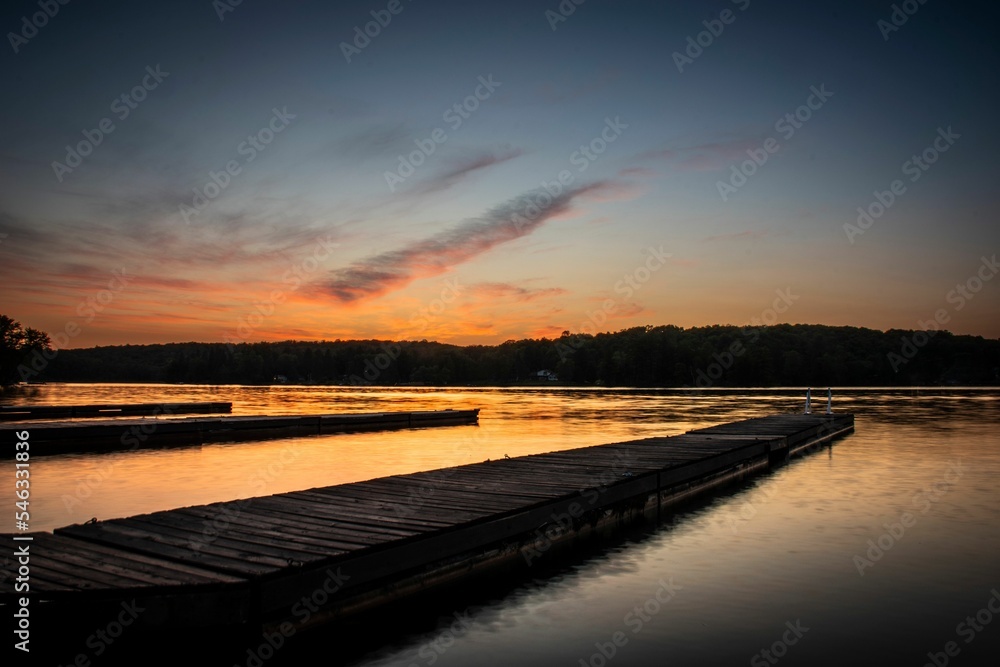 Panoramic view of a beautiful sunset over a lake in the Kawartha region of Ontario, Canada