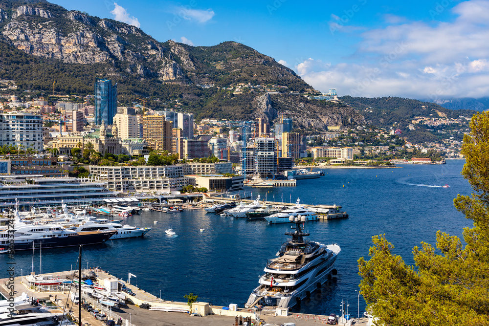 Panoramic view of Monaco metropolitan area with Hercules Port, La Condamine, Monte Carlo and Fontvieille quarters at Mediterranean Sea coast