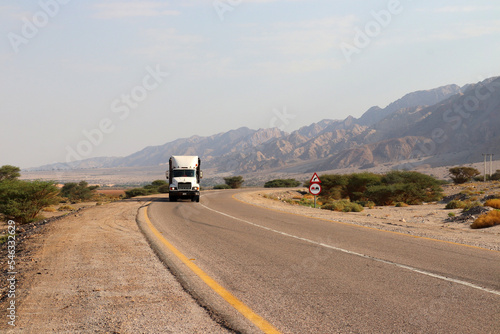 Aqaba, Jordan - a truck is driving on a highway