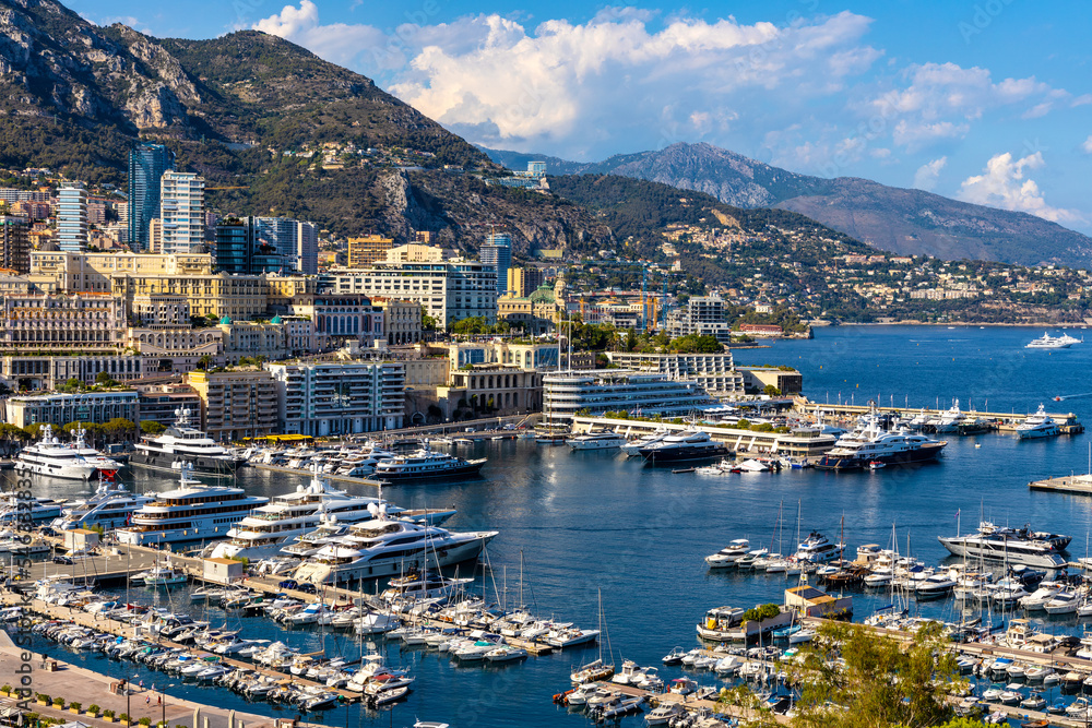 Panoramic view of Monaco metropolitan area with Hercules Port, La Condamine, Monte Carlo and Fontvieille quarters at Mediterranean Sea coast