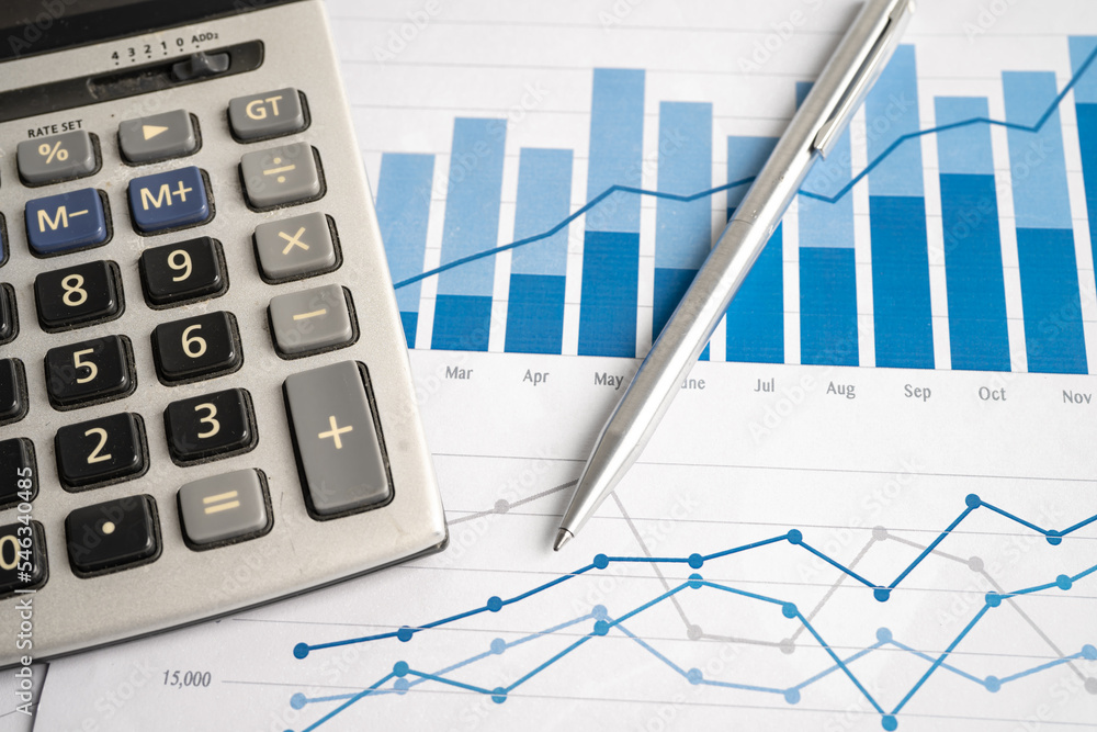 Calculator on chart and graph spreadsheet paper. Finance development, Banking Account, Statistics, Investment Analytic research data economy, Stock exchange trading, Business company concept. Calculator on chart and graph spreadsheet paper. Finance development, Banking Account, Statistics, Investment Analytic research data economy, Stock exchange trading, Business company concept.