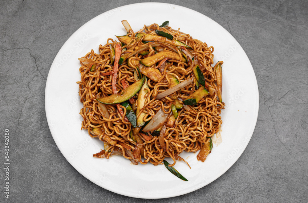 vegetable yakisoba on a rustic background. vegetable yakisoba on a rustic background.