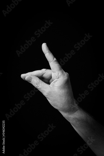Hand demonstrating the Arabic sign language letter 'ط' or 'Tah'