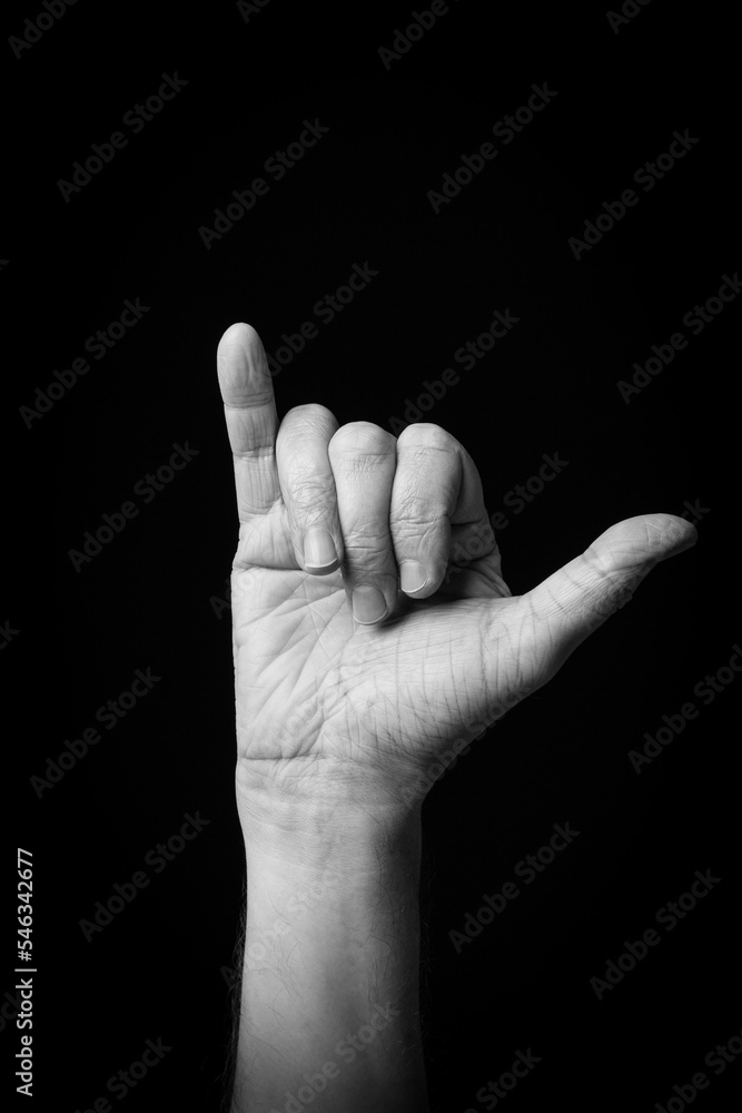 Hand demonstrating the Arabic sign language letter 'ى' or 'YA' Hand demonstrating the Arabic sign language letter 'ى' or 'YA'