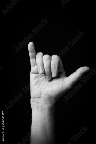 Hand demonstrating the Arabic sign language letter 'ى' or 'YA'