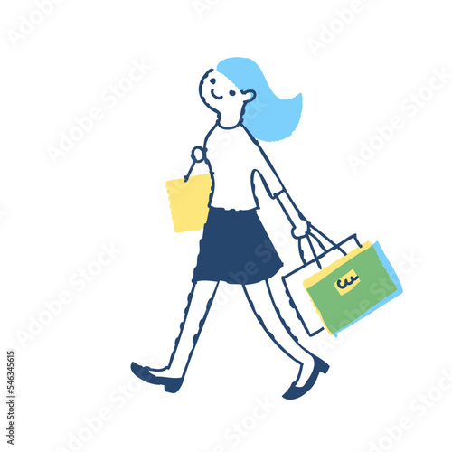 ショッピングバッグを持って歩く若い女性