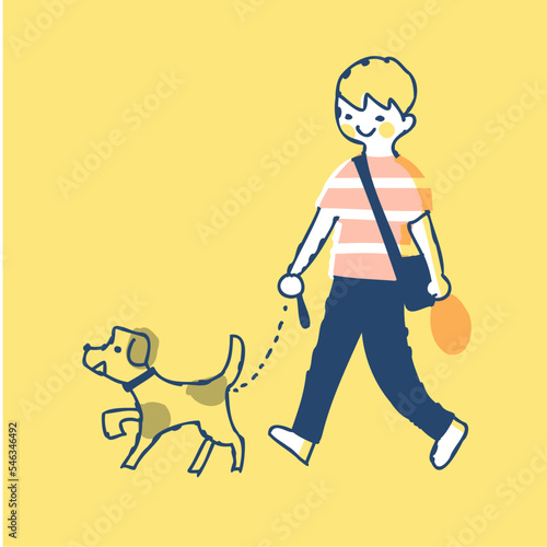 犬の散歩をしている男の子