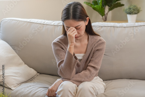 Burnout, weary asian young woman, girl have eyestrain, dizzy, hand touch nose, expression to face difficulty, failure and exhausted. Tired, bad or suffering depression feeling bored alone at home.