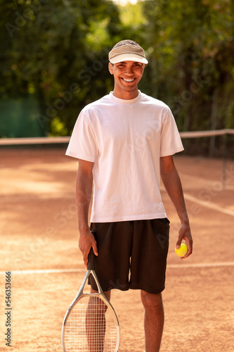 Young male tennis player at the tennis court © zinkevych