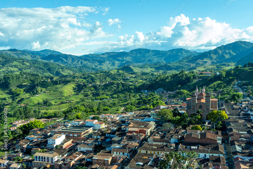 Wide panorama of the superb village (pueblo) of Jerico, antioquia, Colombia, with a blue sky and the Andes Mountains in the background. Picture taken from El Morro El Salvador.