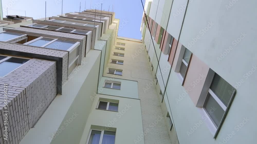 Apartment building. Insulation of the facade of an apartment building. View from bottom to top. Apartment building. Insulation of the facade of an apartment building. View from bottom to top.
