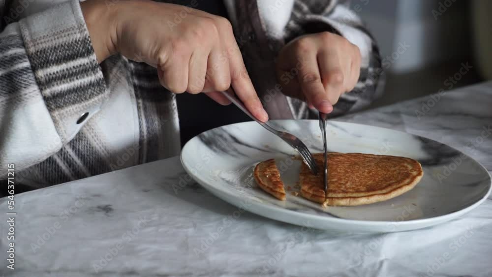 ethnic woman girl eating breakfast pancakes butter knife fork tattoos tattooed plaid fall autumn winter morning home weekend relaxing brunch eating hungry indian arab home life brown hair hands eat ethnic woman girl eating breakfast pancakes butter knife fork tattoos tattooed plaid fall autumn winter morning home weekend relaxing brunch eating hungry indian arab home life brown hair hands eat