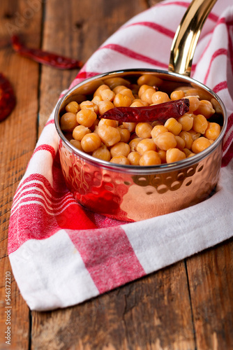 Chickpeas, channay and chana masala served in dish isolated on table side view of arabian food photo