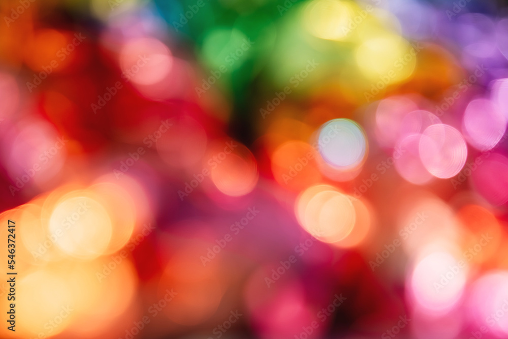 Blurred bokeh background for Christmas and New Year holiday. Abstract colorful wallpaper with defocused lights. Copy space