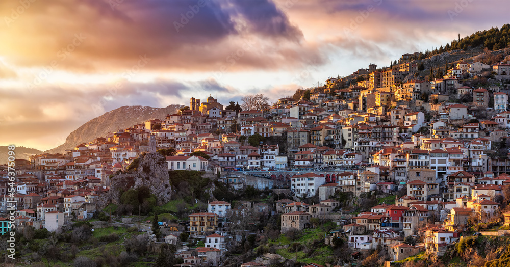 The popular village of Arachova, Boiotia, Greece, at the slopes of Parnassus mountain during a golden winter sunset