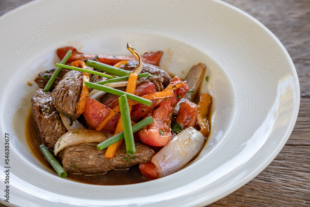 Typical peruvian food and drinks, tenderloin sautéed Typical peruvian food and drinks, tenderloin sautéed
