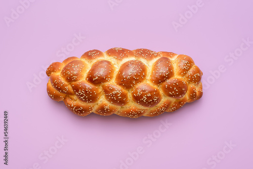 Challah bread above view, isolated on a purple background