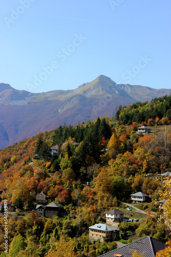 Vertical landscape of a mountain village in the steep mountains with a peek in the background. village Galicnik, National Park Mavrovo, Macedonia 
