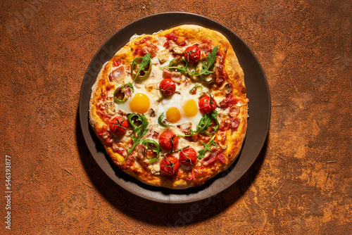 breakfast pizza with eggs, top view