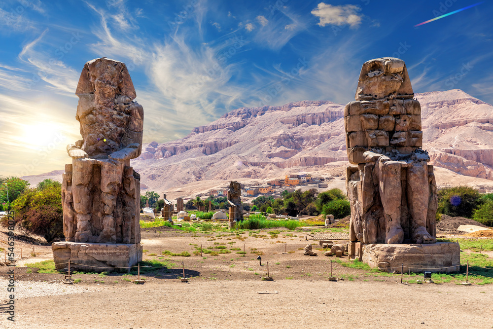 The Colossi of Memnon, famous statues of the Pharaoh Amenhotep in the Theban Necropolis of Luxor, Egypt