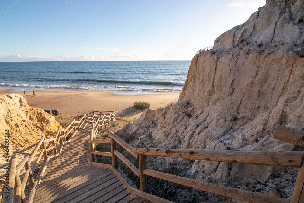 One of the most beautiful beaches in Spain, called (Cuesta Maneli, Huelva) in Spain.  Surrounded by dunes, vegetation and cliffs.  A gorgeous beach.