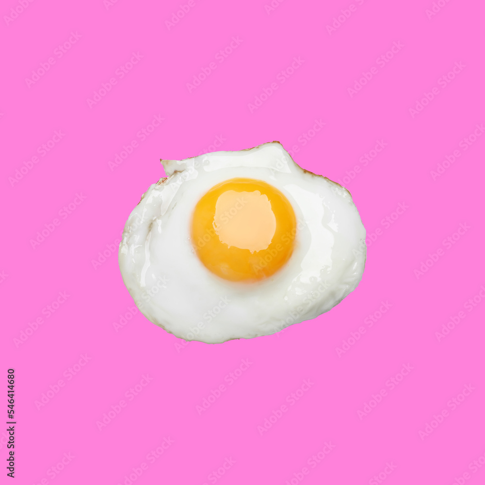Fototapeta premium Tasty fried chicken egg on pink background, top view