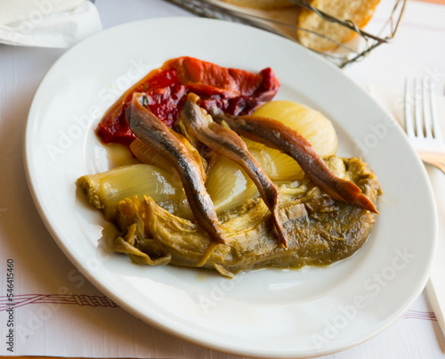 Catalan cuisine. Popular tapa escalivada from roasted vegetables garnished with anchovies..