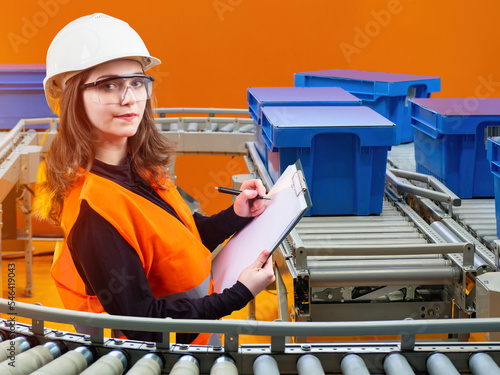 Warehouse worker woman. Gir...