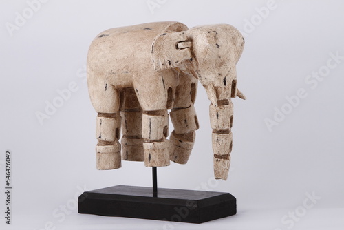 Paper mache elephant with moveable joints on display stand photo