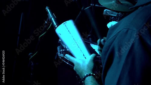 man playing the cowbell in a salsa orchestra, live music