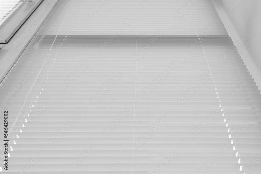 Obraz premium Stylish window with horizontal blinds, low angle view