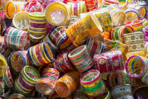 Bright colorful Rajasthani bangles being sold at famous Sardar Market and Ghanta ghar Clock tower in Jodhpur, Rajasthan, India. photo