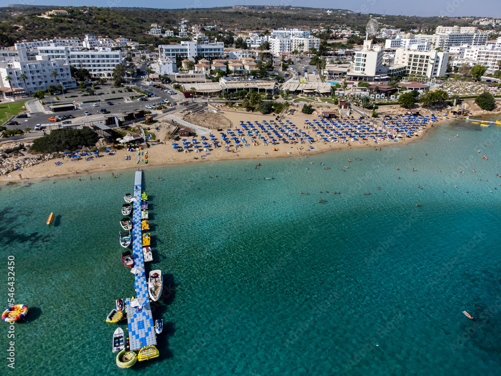 Aerial panoramic view on holidays resorts and blue crystal clear water on Mediterranean sea near Fig Tree beach, Protaras, Cyprus