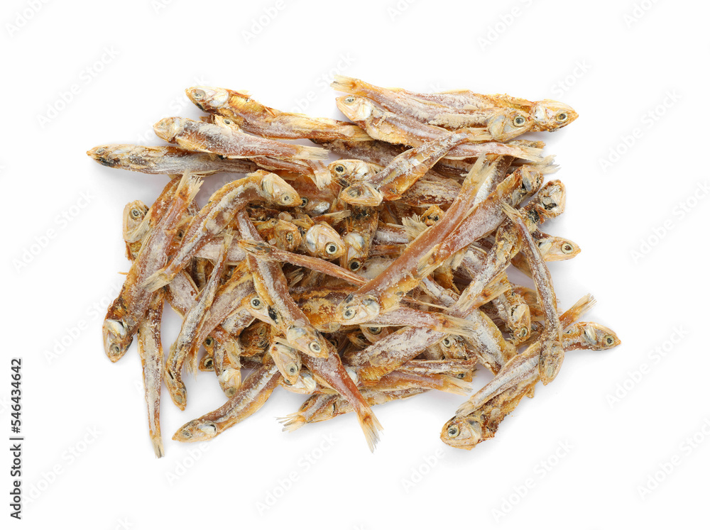 Delicious dried salted anchovies on white background, top view