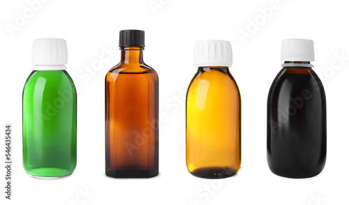 Set with bottles of cough syrup on white background