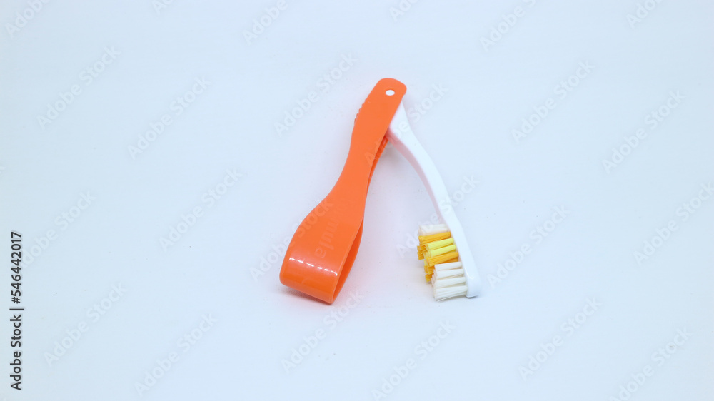 Foldable toothbrush that is easy to carry anywhere isolated white green Foldable toothbrush that is easy to carry anywhere isolated white green