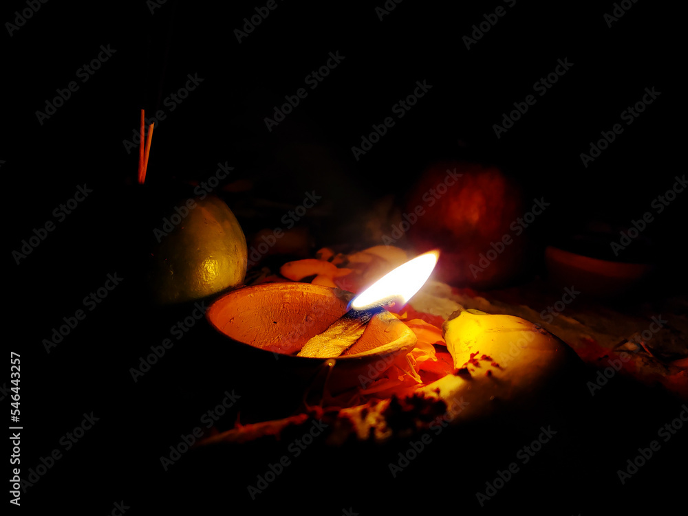 Burning oil lamp on Hindu rituals, Hindu devotee offer Prasad, fruits