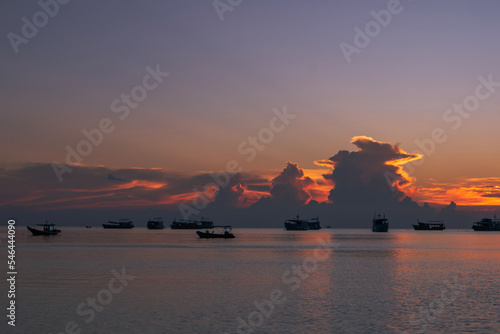 Thai fishing boats at sunset in Koh Tao