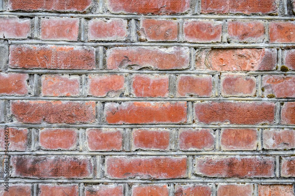 Old weathered and deteriorating brick wall, as a grungy background
Old weathered and deteriorating brick wall, as a grungy background