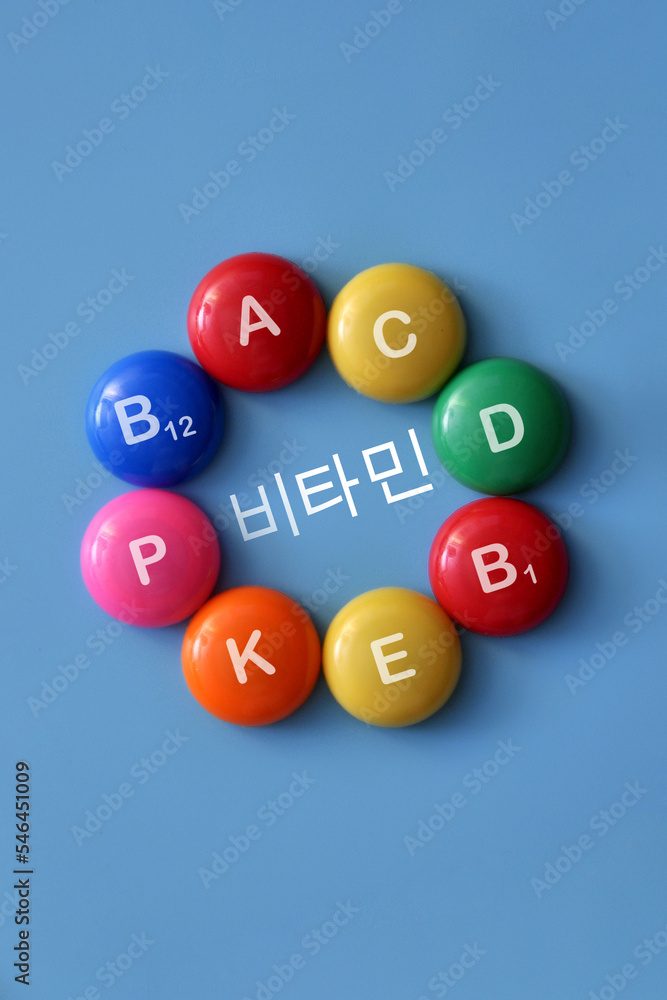 Vitamin icons on bright mugs. A symbol of the body's need for vitamins Vitamin icons on bright mugs. A symbol of the body's need for vitamins